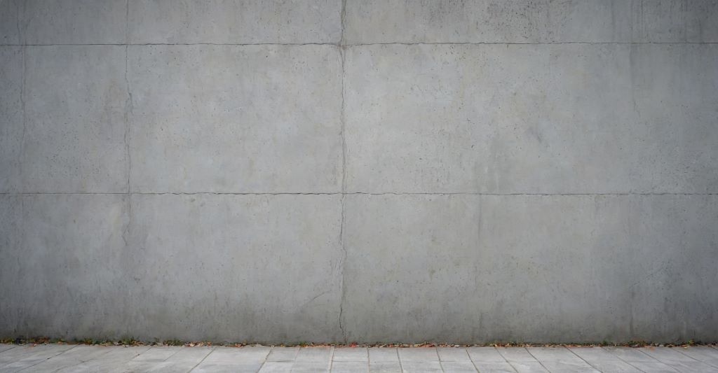 A plain concrete wall with a smooth surface